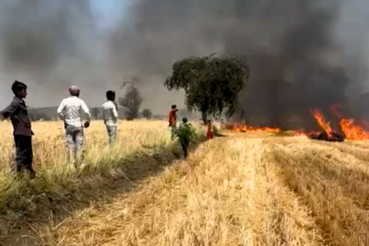 Farmers trying to extinguish fires in their farmland