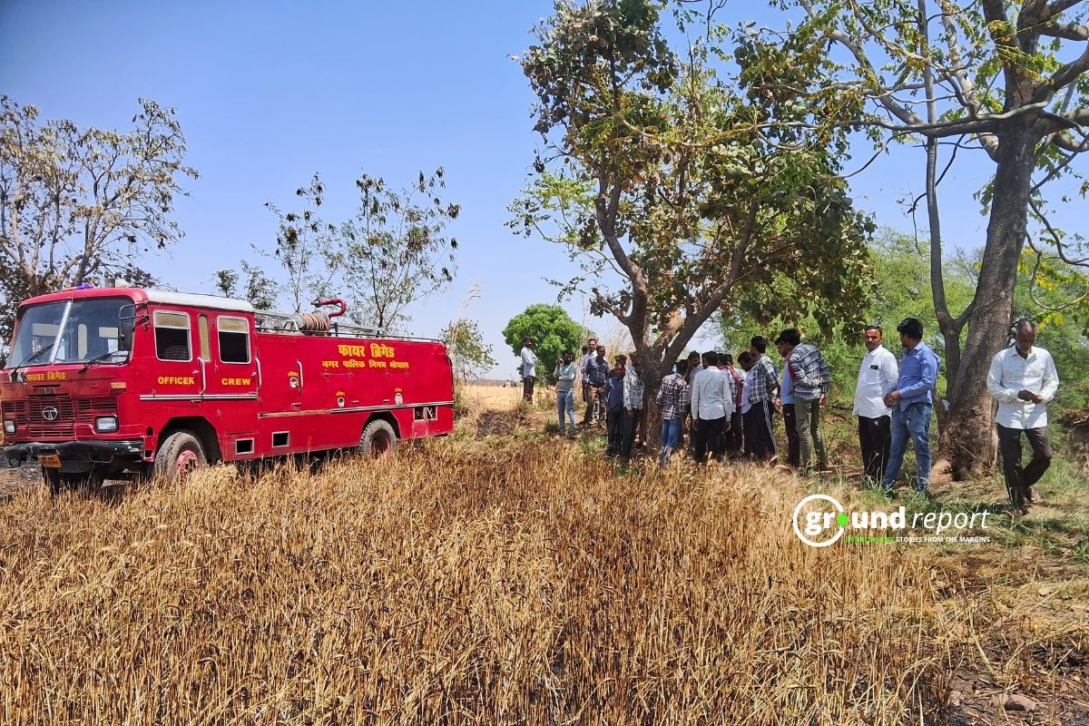 Fire brigade in an agriculture field to extinguish farm fire