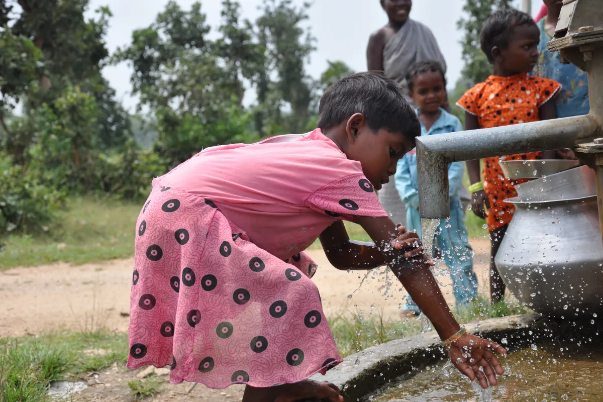 Girl washing hand in Purulia