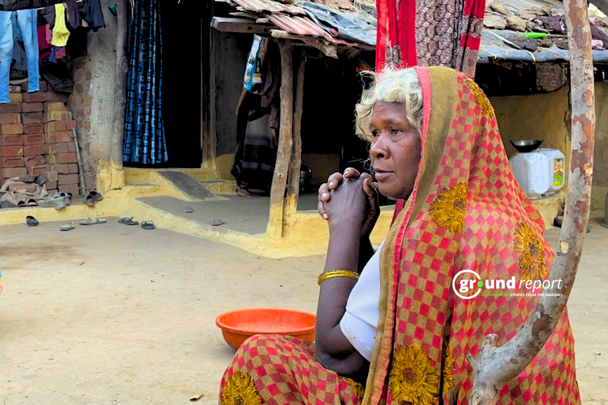 Gangabai sitting outside her mud house