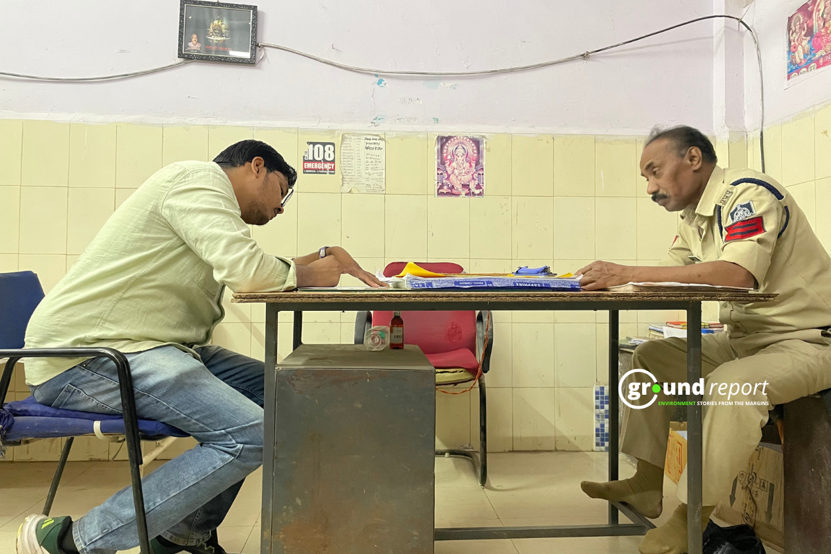 A police constable at the district hospital writes down the names of people affected by pesticide poisoning while our reporter observes.