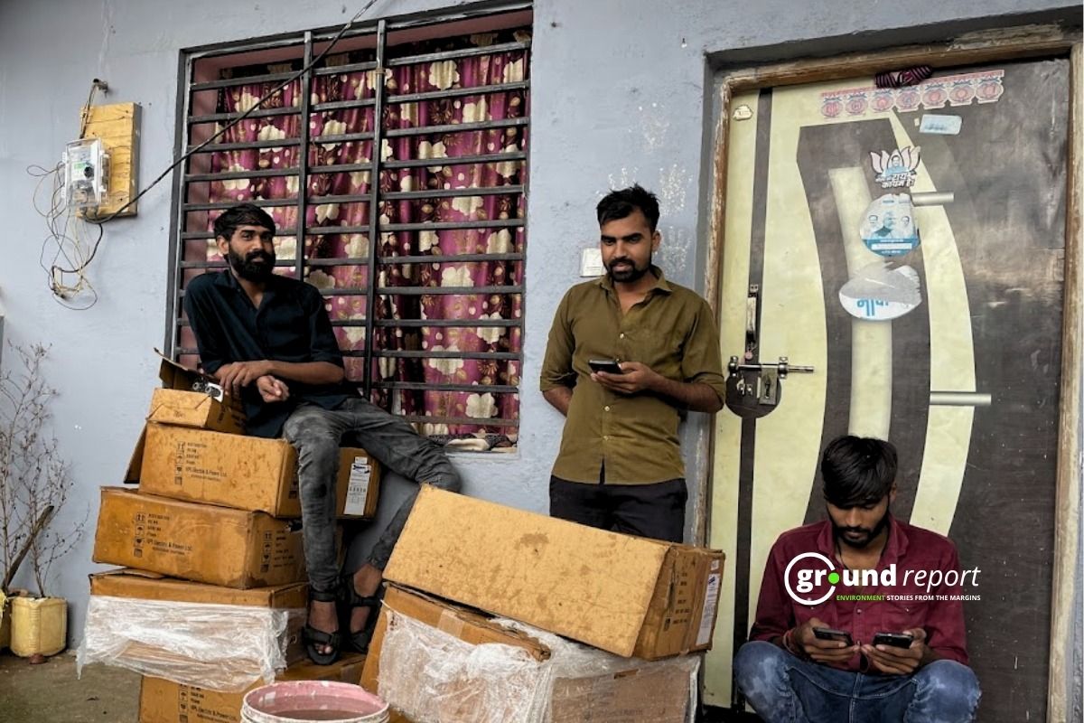 Technicians resting after installing smart meters in Badiyakhedi area of Sehore