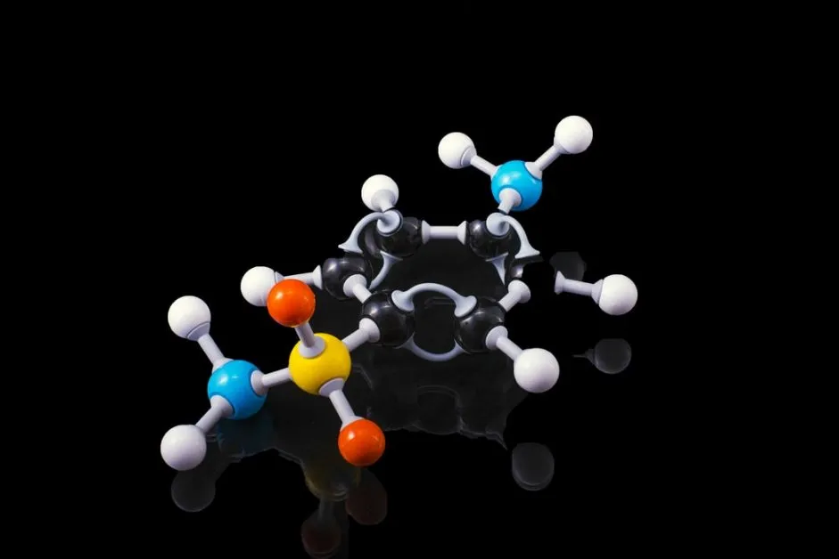 A molecule model with reflection on a dark surrounding. Sulfanilamide if someone is really interested !! Sulfanilamide was a medicine used to treat streptococcal infections. One version of the drug, in liquid form, was introduced in the market after having being tested only for flavor, appearance and fragrance but not for toxicity. It caused the deaths of more than 100 people back in 1937. As we are all awaiting the cure for COVID19 let his be a reminder of what untested, unsafe and "rushed to market" drugs can do to people.