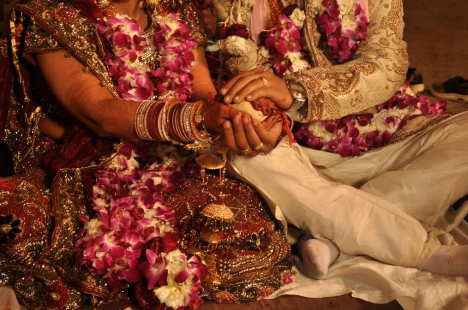 How does the caste system affect marriages in India?
